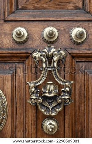 Detail of the beautiful handle of the old door of the General Captaincy of Barcelona Royalty-Free Stock Photo #2290589081