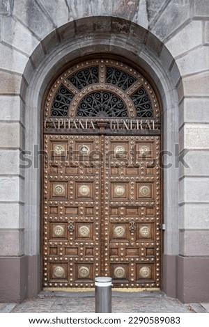 Detail of the beautiful wooden door with metal inlays of the General Captaincy of Barcelona Royalty-Free Stock Photo #2290589083