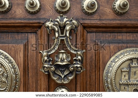 Detail of the beautiful handle of the old door of the General Captaincy of Barcelona Royalty-Free Stock Photo #2290589085