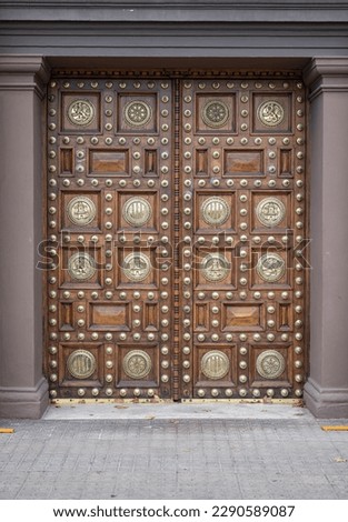 Detail of the beautiful wooden door with metal inlays of the General Captaincy of Barcelona Royalty-Free Stock Photo #2290589087
