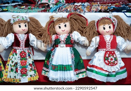 Hand made dolls dressed in romanian traditional folk costumes. Royalty-Free Stock Photo #2290592547