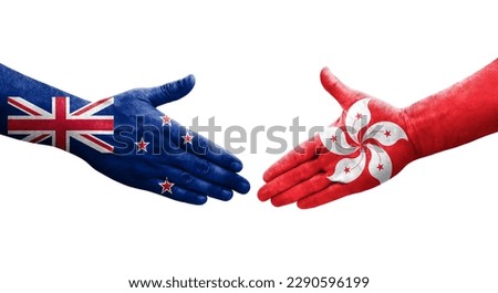 Handshake between Hong Kong and New Zealand flags painted on hands, isolated transparent image.
