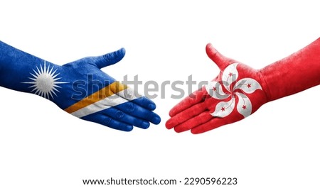 Handshake between Hong Kong and Marshall Islands flags painted on hands, isolated transparent image.