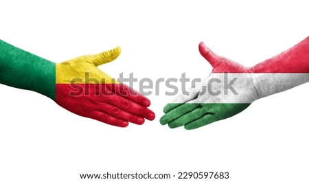 Handshake between Benin and Hungary flags painted on hands, isolated transparent image.