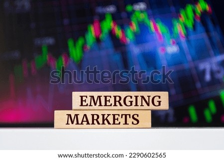 Wooden blocks with words 'EMERGING MARKETS'. Business concept Royalty-Free Stock Photo #2290602565
