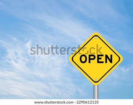 Yellow transportation sign with word open on blue color sky background