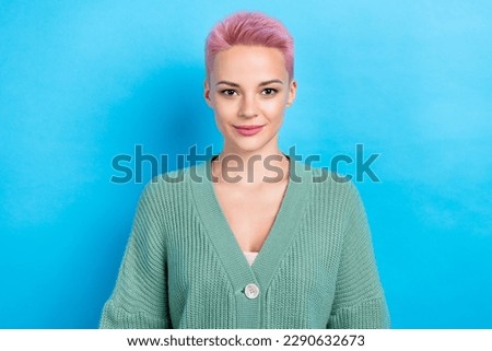 Photo of youngster cute lady smiling positive good mood face pink short hairdress wear cardigan isolated blue color background Royalty-Free Stock Photo #2290632673