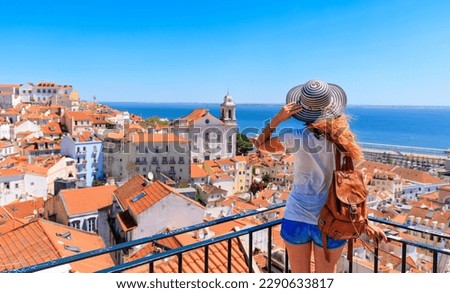 Woman tourist on balcony looking at panoramic view of Lisboa- Tourism,  vacation,  travel in Portugal Royalty-Free Stock Photo #2290633817