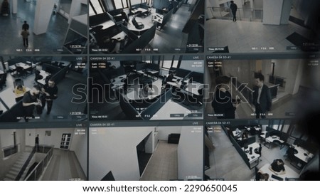 Security operator controls CCTV cameras in business office, uses digital tablet with surveillance cameras playback on screen. High tech security with facial recognition. Monitoring and social safety. Royalty-Free Stock Photo #2290650045