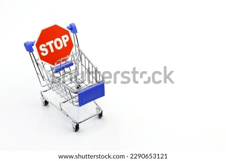A supermarket trolley with the STOP sign.  Control of household spending, price increases. Inflation