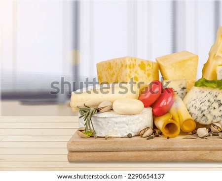 Cheese board with tasty fresh cheese and berries