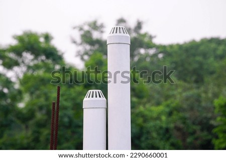 Plastic pipes for gas discharge from a septic tank, Pvc pipes in building rooftop  Royalty-Free Stock Photo #2290660001