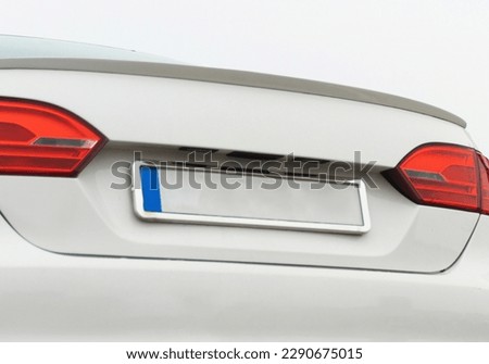 Blank License Plate On vehicle. empty License Plate. no text. place for text, space for text. blank white license plate on a car with copy space. Blank License Plate On car.