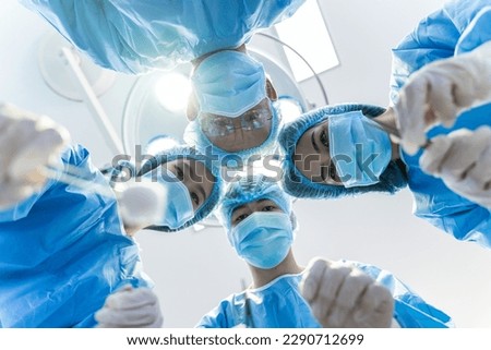 Medical Team Performing Surgical Operation in hospital operating. Medical team doing critical operation. Royalty-Free Stock Photo #2290712699