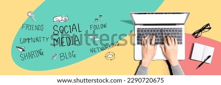 Social media theme with person using a laptop computer