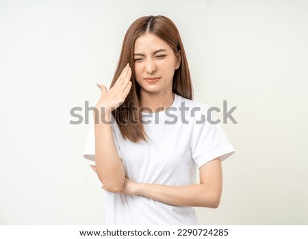 Bad smell stinks. Young beautiful asian woman pinching nose with disgust. Holding breath with fingers on nose Royalty-Free Stock Photo #2290724285