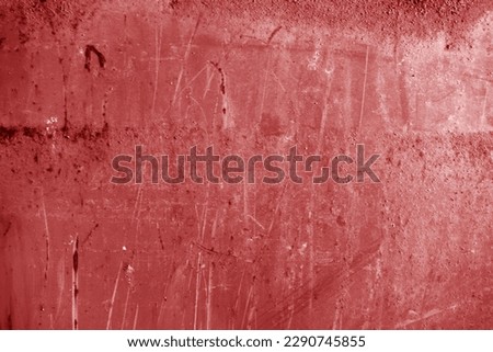 Grungy rusted metal surface in red tone. Abstract background and texture.