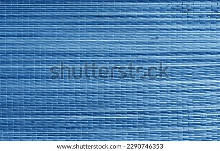 Natural bamboo wallpaper texture in navy blue color. Background and texture.