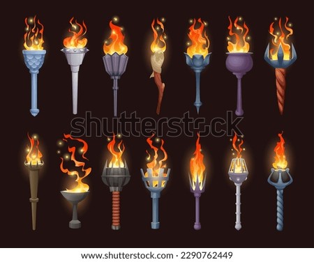 Burning torch light. Game asset tools stick burning flame exact vector illustrations set