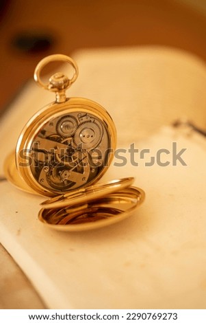 vintage gold pocket watch longines isolated on white background