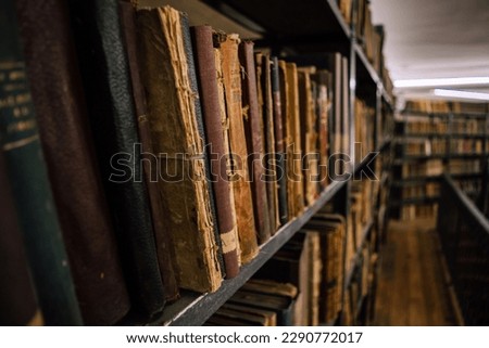 Shelves with old books in a library