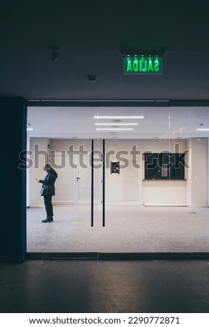 Long angle view of lonely person on a wide room