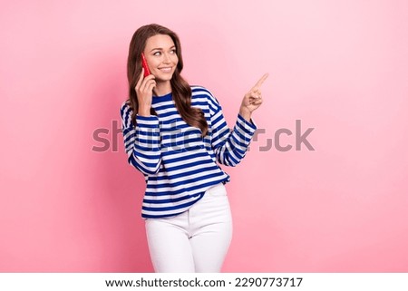Photo of nice woman wavy hairdo wear striped shirt talking on cellphone look empty space delivery order isolated on pink color background