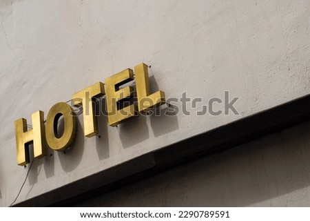 Hotel sign on wall exterior,