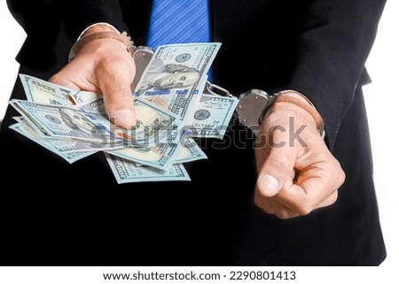money in the hands of a businessman crime in a crisis raising business concept bank worker