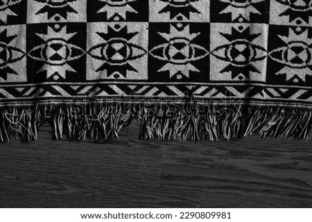 A beautiful carpet on the floor. Black and white photo