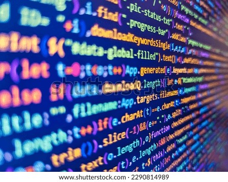 Programming code. Javascript lines of code into a library for website application. Modern tech. Shallow depth of field, selective focus effect. Programmer Typing New Lines of HTML Code