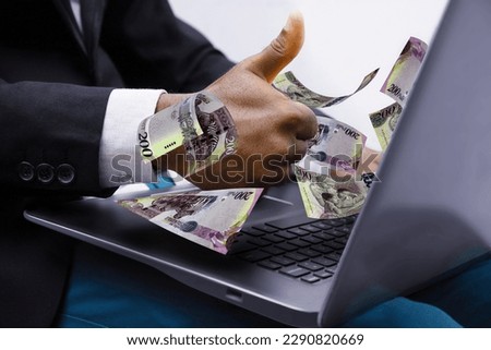 Botswanan Pula notes coming out of laptop with Business man giving thumbs up, Financial concept. Make money on the Internet, working with a laptop
