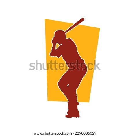Silhouette of a woman playing baseball. Silhouette of a female baseball player in action pose with a baseball bat.