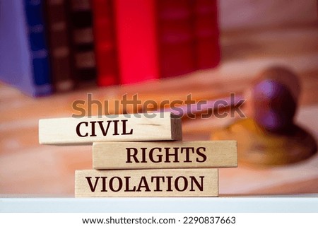 Wooden blocks with words 'CIVIL RIGHTS VIOLATION'. Legal concept Royalty-Free Stock Photo #2290837663
