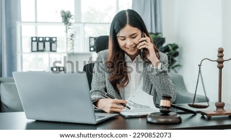 Call mobile, cellphones, Online consulting with laptop in office of asian thai japanese chinese female exclusive lawyer legal advisor, legislation, saleswoman, legal contract documents