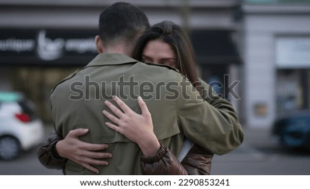 Young couple romantic embrace outside in urban street. Man consoling girlfriend suffering from problems. Empathic relationship concept Royalty-Free Stock Photo #2290853241