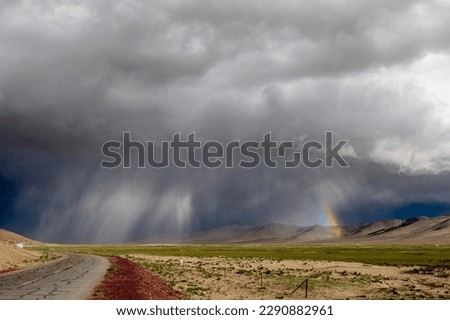 Thunderstorm and rainbow at the tibetan plateau , Tibet, China