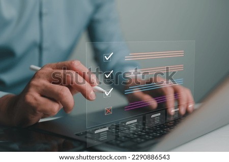 Document management system DMS. Assessment form, questionnaire, checklist and clipboard task management. Businessman working on laptop computer productivity checklist and filling survey form online. Royalty-Free Stock Photo #2290886543
