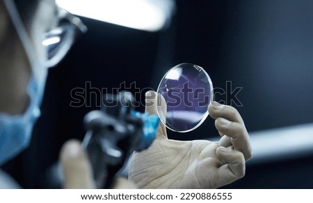 Factory for making spectacle lenses and frames, myopia glasses, sunglasses, production line Royalty-Free Stock Photo #2290886555