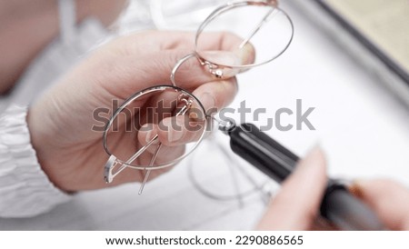 Factory for making spectacle lenses and frames, myopia glasses, sunglasses, production line Royalty-Free Stock Photo #2290886565