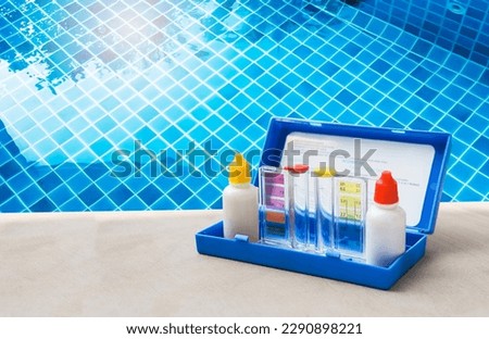 Water tester over clear swimming pool, best water quality, pool maintenance, water test kit, Water testing test kit for swimming pool Royalty-Free Stock Photo #2290898221