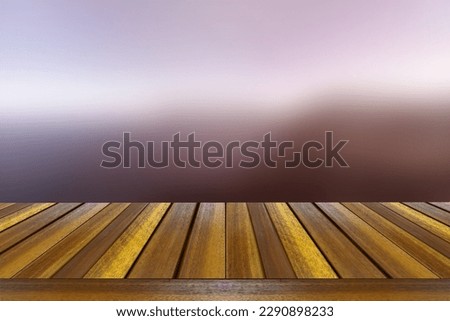Mock up wooden plank  table top on pink  blurred glitter background. Ideal for montage or display your product.
