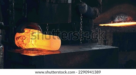 Open cast die forging of a metal block Royalty-Free Stock Photo #2290941389