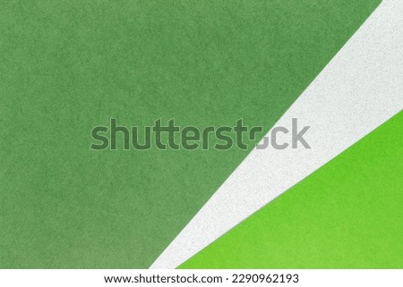 Green and white paper background with copy space for text or image.