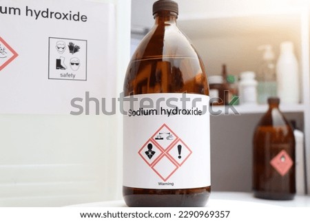 sodium hydroxide, Hazardous chemicals and symbols on containers, chemical in industry or laboratory  Royalty-Free Stock Photo #2290969357