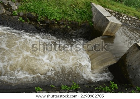 Pictures of irrigation water for irrigating rice fields in rural Indonesia