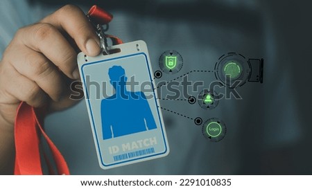 Close up of office man using ID staff card to scan for entering a username and password of data. Logging in with a staff id card