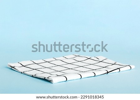 top view with white empty kitchen napkin isolated on table background. Folded cloth for mockup with copy space, Flat lay. Minimal style. Royalty-Free Stock Photo #2291018345