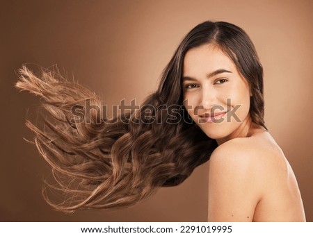 Hair, beauty and portrait of woman in studio for wellness, hairstyle treatment and health on brown background. Salon aesthetic, smile and face of happy girl with cosmetics, keratin and natural style