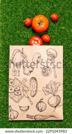 a paper bag lies on the green grass with fruits and vegetables around, moss, mock up